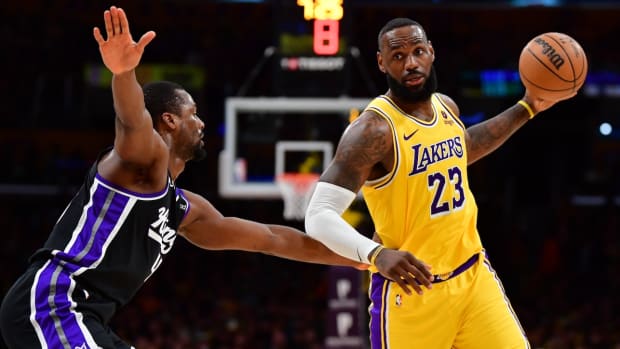 Los Angeles Lakers forward LeBron James controls the ball against Sacramento Kings forward Harrison Barnes (40) during the second half at Crypto.com Arena in Los Angeles on March 6, 2024.